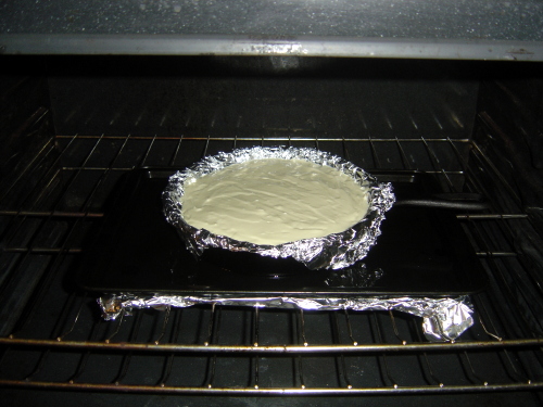 [baking cheesecake in oven with water bath]
